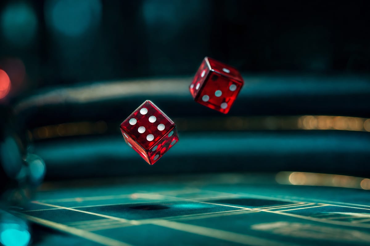 Two translucent red dice tumbling in mid-air above a dimly lit dice table, both caught just before landing (AI-generated image)
