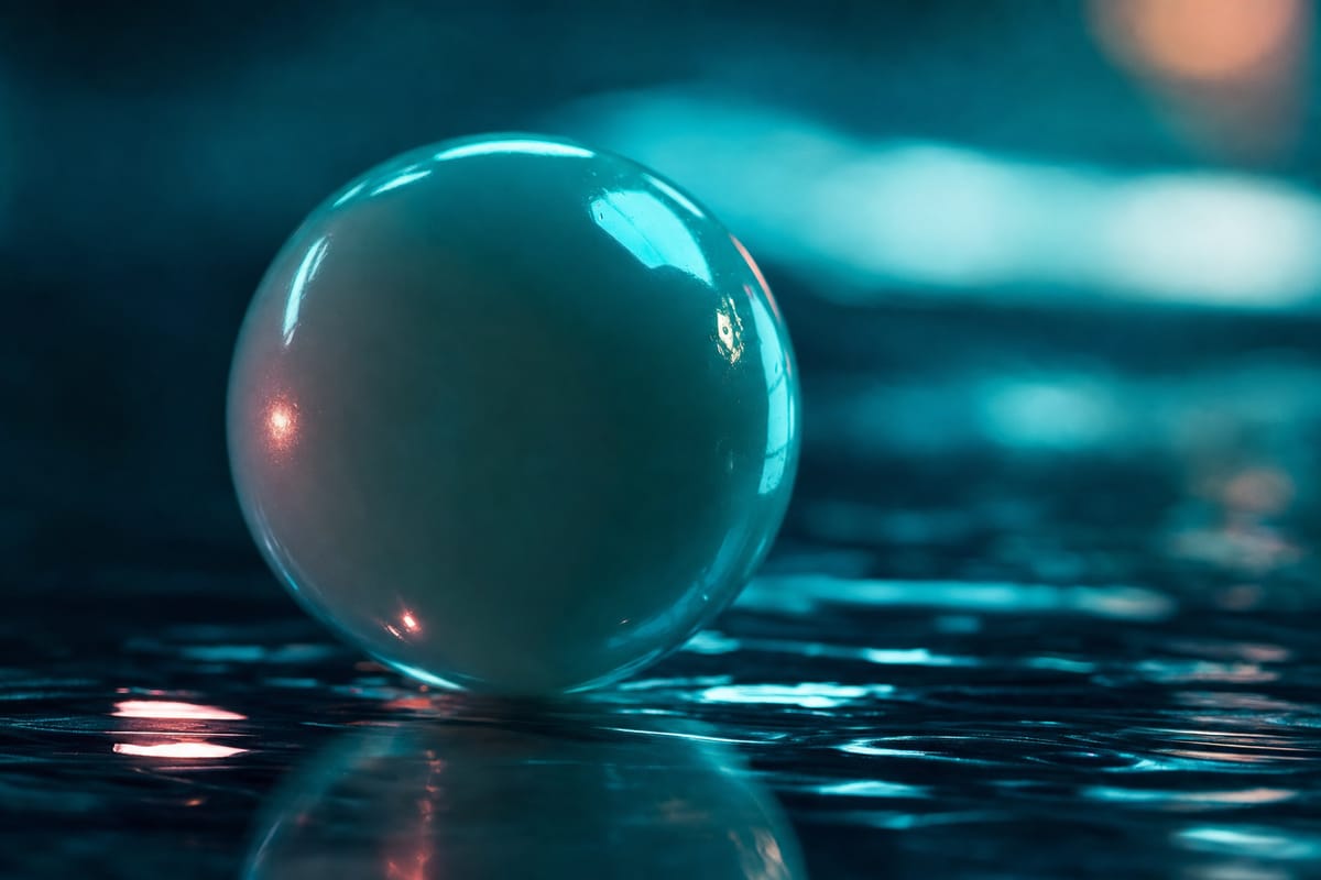 Single pale translucent ball resting on rippled dark water, catching teal and coral highlights (AI-generated image)
